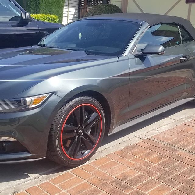 Tinted grey 2016 mustang convertible with black and red rims