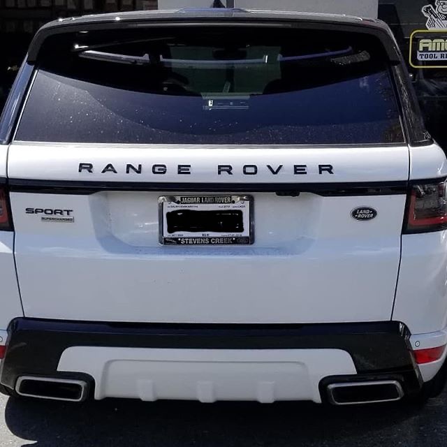 Back White Range Rover sport with window tint