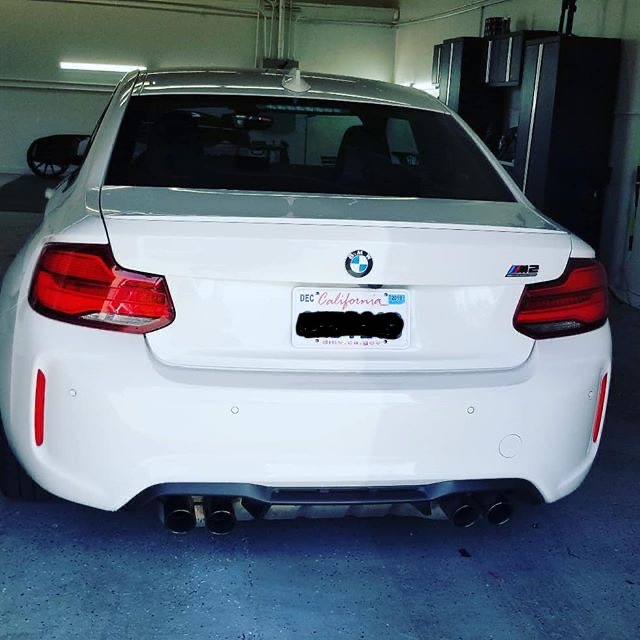 White BMW M2 with rear window tint